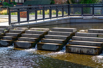 Modern water steps on the Brda River in Bydgoszcz, near the riverside promenade by the Rother's...