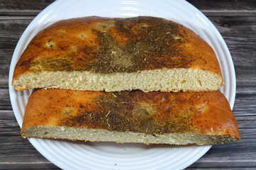 a two halves of Thyme Turkish soft bread made of Yoghurt Yogurt, flour, yeast, Turkish bread...