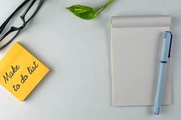 Organized Workplace Setup with Pen, Notepad, and To-Do List Note