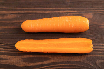 Orange Carrot on brown wooden, Side view, close up