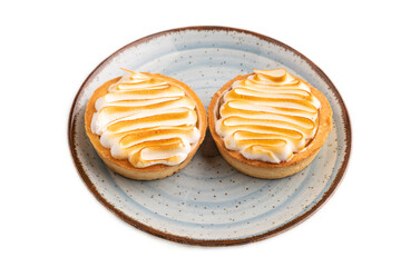 French lemon tart with meringue isolated on white, side view, close up
