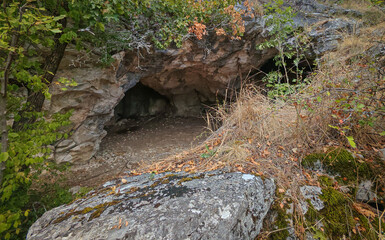 Twin cave openings in a limestone cliff near Suba-lyuk, part of an important prehistoric site in the Bükk Mountains.