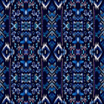 An ornate, seamless pattern with a complex and symmetrical ikat motif, inspired by traditional Persian rugs and textiles in bold shades of blue, white, and purple.