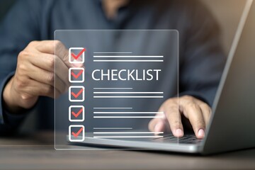 Person completing a digital checklist on a transparent screen with laptop