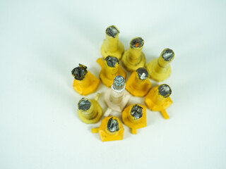 Unique collection of vintage spark plugs arranged artistically on a clean white background