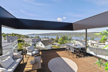 cozy luxury summer terrace with furniture and beautiful seascape
