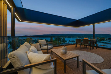 cozy luxury summer terrace with furniture and beautiful seascape

