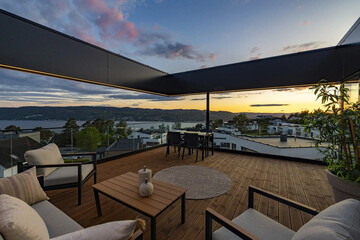 cozy luxury summer terrace with furniture and beautiful seascape
