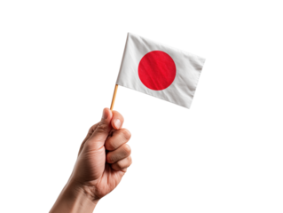 A person's hand confidently holds a small, fluttering Japanese flag against a neutral backdrop