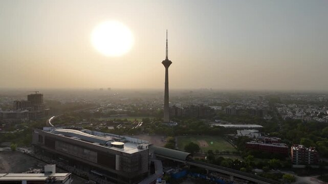 4k Aerial Drone footage of sunset in Pitampura Tv Tower Netaji Subhash Place Metro train Station  in Delhi India