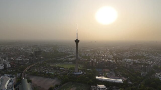 4k Aerial Drone footage of sunset in Pitampura Tv Tower Netaji Subhash Place Metro train Station  in Delhi India