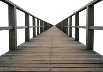 A long, weathered wooden pier with railings leading into the distance, isolated on a transparent background