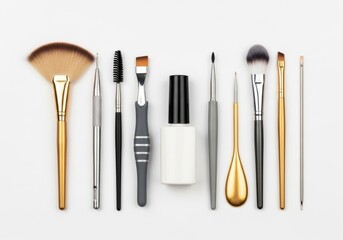 Flat lay collection of professional makeup brushes, nail art tools, and cosmetic accessories on white background