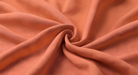 Close-up view of a soft, smooth coral-colored fabric with gentle folds, showcasing an elegant textile pattern, perfect for fashion and interior design applications