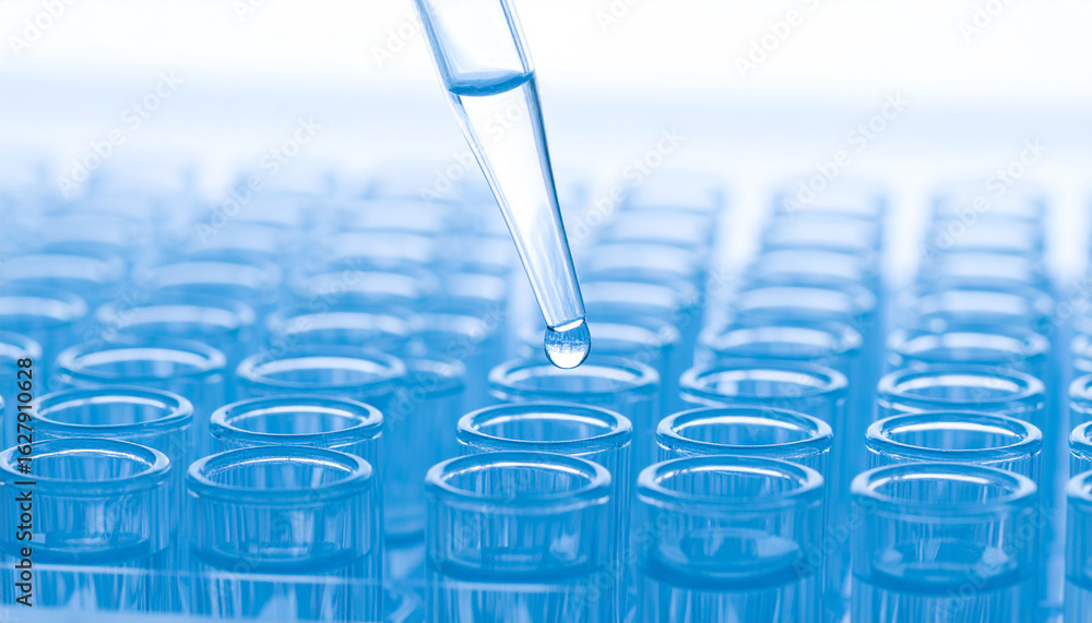 Poster precision in science: a close-up view of a pipette dispensing a precise droplet of liquid into a sci