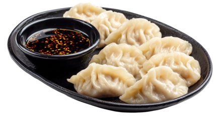 Traditional dumpling momos food from Nepal served with tomato chutney in plate isolated.