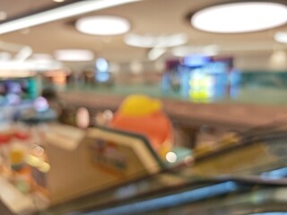 Abstract bokeh image of colorful toy store display with out-of-focus lights.