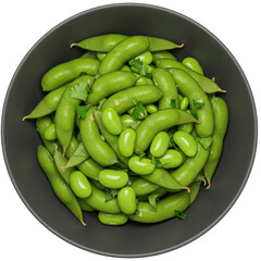A vibrant bowl filled with fresh green edamame pods and soybeans, garnished with herbs