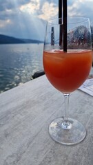 Serenity and reflection — enjoying a summer drink by the lake