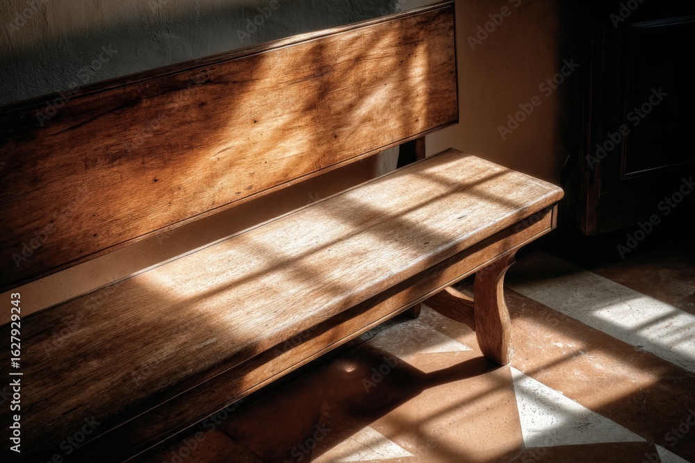 Aufkleber light streaming through a window casts patterns on an empty wooden bench in a quiet interior space
