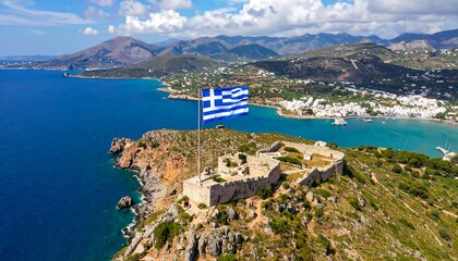 Aerial view of a Greek fort, flag, and coastline