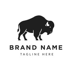 Obraz premium Bold Bison Silhouette Logo Concept for Brand Identity and Marketing Material Strong Animal Representation Flat Design Ideal for Business Branding