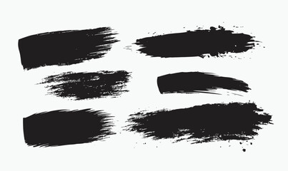 Black ink brush strokes set with textured grunge paint splatters and rough edges on white background for design elements and artistic backgrounds