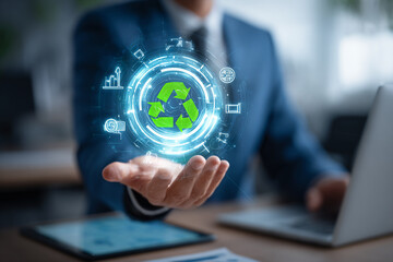 A businessman holds a glowing hologram of the recycling symbol, representing a commitment to sustainability and green business practices