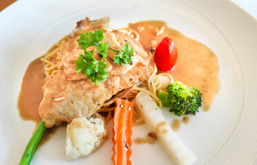 Beautiful presentation of chicken in soy sauce with vegetables in a small cafe