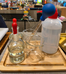 Various pieces of laboratory equipment commonly used for handling and dispensing liquids, including...