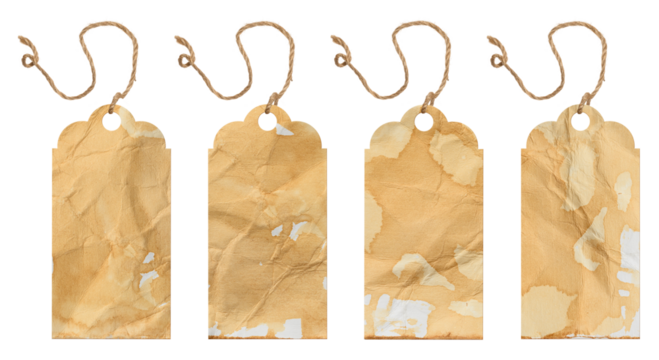 Vintage tags made of paper stained with coffee or tea. Each tag has unique marks and an uneven surface, hung on a string.