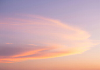 Pastel color sky at sunset with soft clouds in a dreamy, serene gradient. Peaceful nature concept.