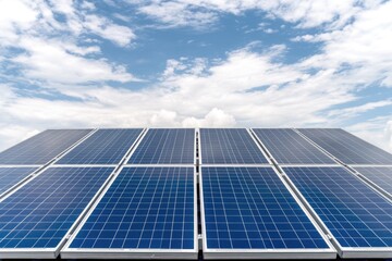 Close-up of solar panels against blue sky, symbolizing clean energy and sustainable technology
