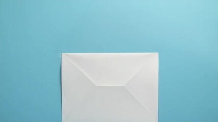 A white envelope sits on a blue background, awaiting its contents - Powered by Adobe