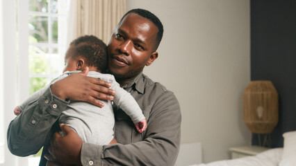 Loving Father Holding Infant Child in a Cozy Family Home
