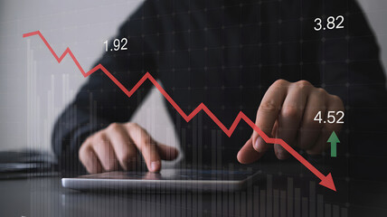 Professional analyzing financial data on tablet, witnessing market downturn with declining red arrow and upward green arrow indicators