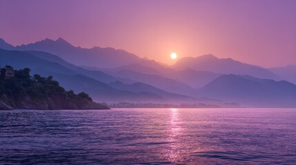 Stunning landscape showing a sunrise over mountains, ocean, and coast