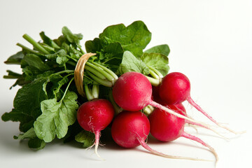Fresh bunch of radishes with leaves isolated on white background for culinary inspiration healthy eating food photography nature top-down view organic gardening