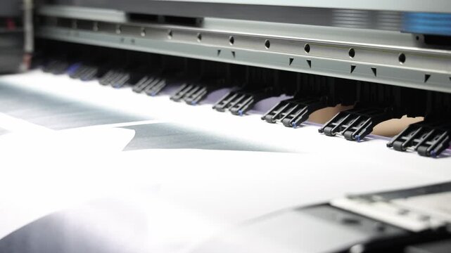 High resolution Industry printer. Industrial inkjet printer in operation. printing patterns on large sheet of fabric or paper. Automate printer for modern textile printing and digital print technology