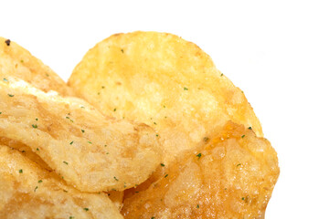 Close up of fresh potato seasoned crisps snack on a white background