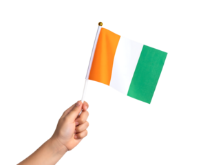 A hand holds the national flag of the Ivory Coast (Côte d'Ivoire), featuring vertical stripes of orange, white, and green.