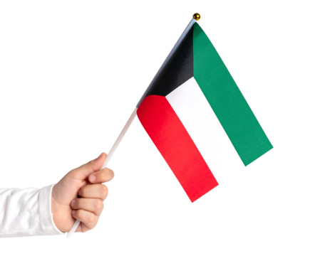 A person's hand holding a Kuwaiti flag, symbolizing patriotism and pride.