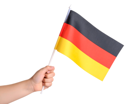 A hand proudly holding and waving the national flag of Germany. - Powered by Adobe