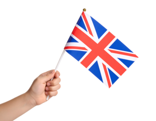 A hand holding the national flag of the United Kingdom.