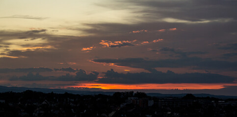 Magnificent sunset in the city, with gray clouds that speak for themselves and scream storm in the background. 