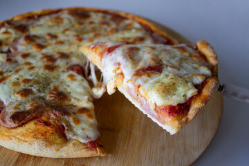 Delicious homemade ham and mozzarella pizza