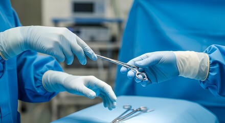 Surgical instruments being passed between gloved hands during an operation