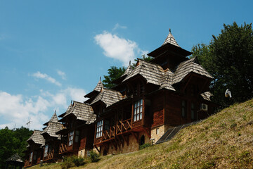 Traditional wooden houses in Mokra Gora, Serbia, with pointed rooftops and rustic design.