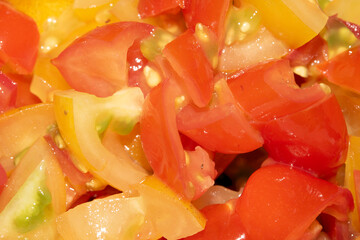 Close up of fresh finely chopped tomatoes red and yellow