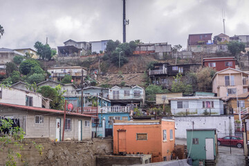 View of Colonia Libertad, Tijuana, showcasing a semi-urban neighborhood with hilly terrain,...